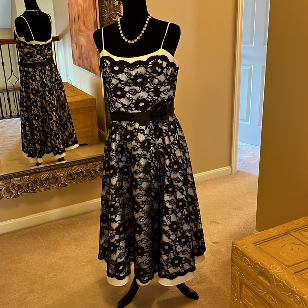Fantastic vintage black and white midi cocktail dress with ribbon flower belt.